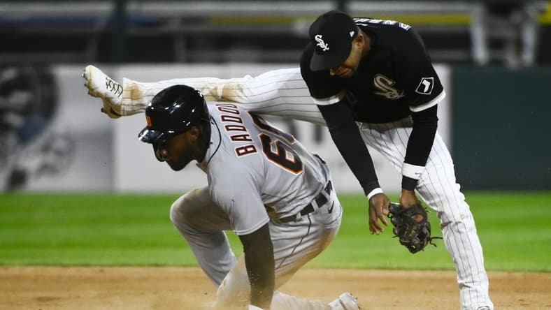 Sep 23, 2022; Chicago, Illinois, USA; Detroit Tigers left fielder Akil Baddoo (60) steals second base under Chicago White Sox shortstop Elvis Andrus (1) during the seventh inning at Guaranteed Rate Field. Mandatory Credit: Matt Marton-USA TODAY Sports