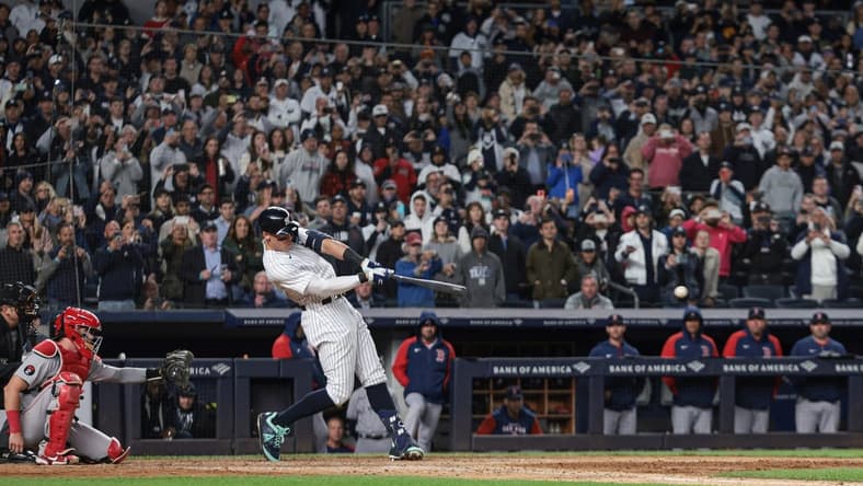 Sep 23, 2022; Bronx, New York, USA; New York Yankees center fielder Aaron Judge (99) singles during the seventh inning against the Boston Red Sox at Yankee Stadium. Mandatory Credit: Vincent Carchietta-USA TODAY Sports