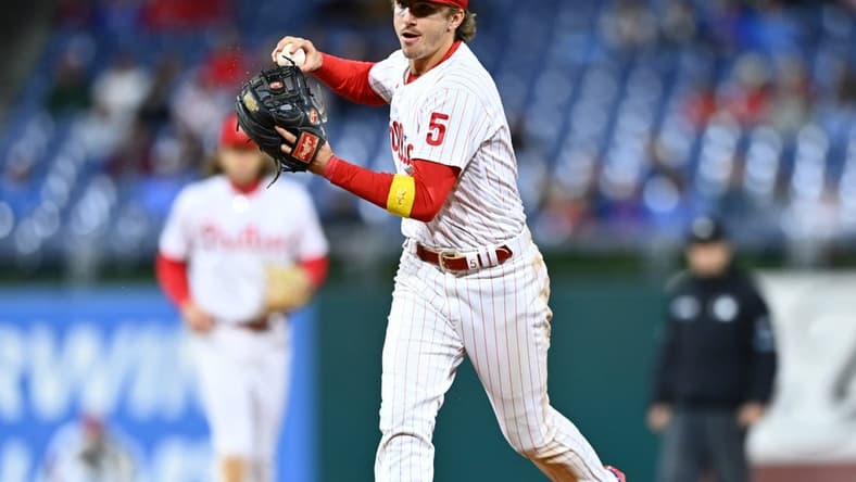 Sep 23, 2022; Philadelphia, Pennsylvania, USA; Philadelphia Phillies infielder Bryson Stott (5) throws to first against the Atlanta Braves in the ninth inning at Citizens Bank Park. Mandatory Credit: Kyle Ross-USA TODAY Sports