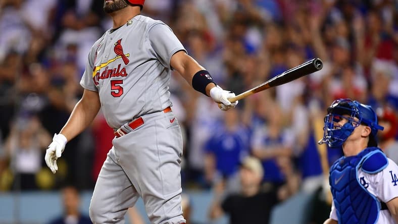 Sep 23, 2022; Los Angeles, California, USA; St. Louis Cardinals designated hitter Albert Pujols (5) hits a three run home run and the 700th of his career against the Los Angeles Dodgers during the fourth inning at Dodger Stadium. Mandatory Credit: Gary A. Vasquez-USA TODAY Sports