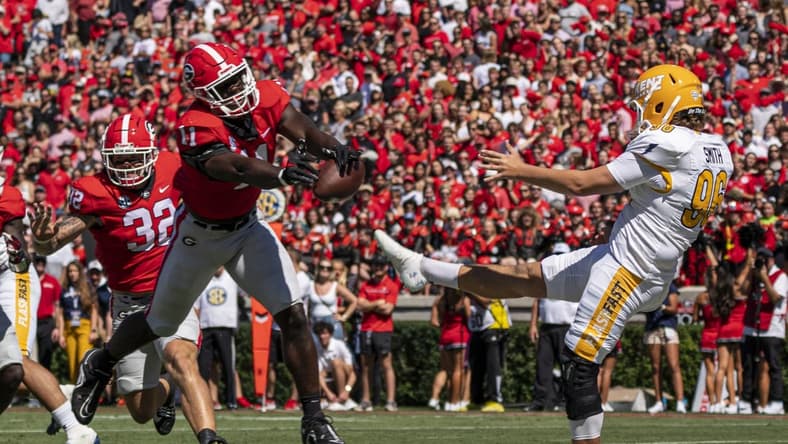 Sep 24, 2022; Athens, Georgia, USA; Georgia Bulldogs linebacker Jalon Walker (11) blocks a punt by Kent State Golden Flashes punter Josh Smith (96) for a safety during the first quarter  at Sanford Stadium. Mandatory Credit: Dale Zanine-USA TODAY Sports