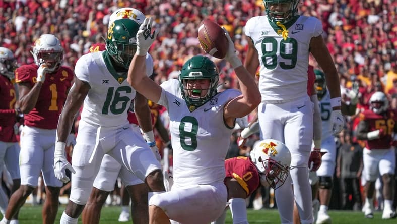 Sep 24, 2022; Ames, Iowa, USA; Baylor tight end Ben Sims (8) scores a touchdown in the first quarter against Iowa State at Jack Trice Stadium. Mandatory Credit: Bryon Houlgrave/Des Moines Register-USA TODAY Sports