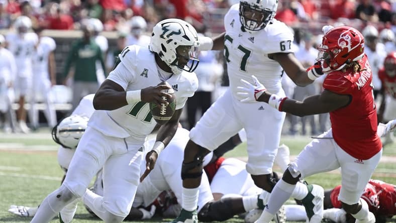 Sep 24, 2022; Louisville, Kentucky, USA; South Florida Bulls quarterback Gerry Bohanon (11) runs the ball against the Louisville Cardinals during the second quarter at Cardinal Stadium. Mandatory Credit: Jamie Rhodes-USA TODAY Sports