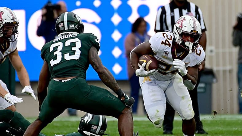 Sep 24, 2022; East Lansing, Michigan, USA; Minnesota Golden Gophers running back Mohamed Ibrahim (24) runs for a first down in the second quarter against the Michigan State Spartans at Spartan Stadium. Mandatory Credit: Dale Young-USA TODAY Sports