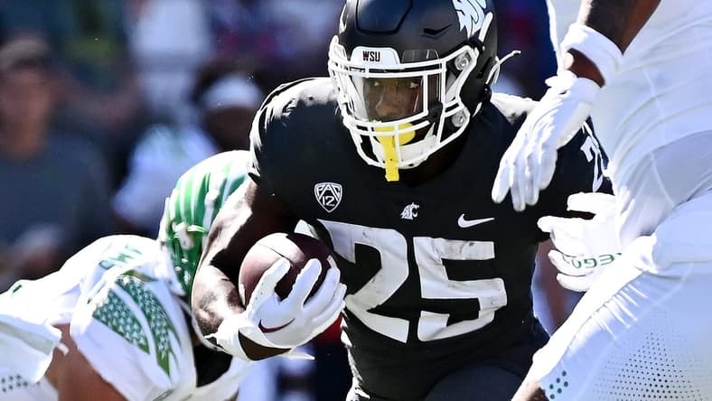 Sep 24, 2022; Pullman, Washington, USA; Washington State Cougars running back Nakia Watson (25) carries the ball against the Oregon Ducks in the first half at Gesa Field at Martin Stadium. Mandatory Credit: James Snook-USA TODAY Sports