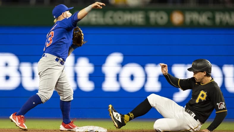 Sep 24, 2022; Pittsburgh, Pennsylvania, USA; Chicago Cubs second baseman Esteban Quiroz (43) throws to first base after forcing Pittsburgh Pirates center fielder Bryan Reynolds (10) during the fifth inning at PNC Park. Mandatory Credit: Scott Galvin-USA TODAY Sports