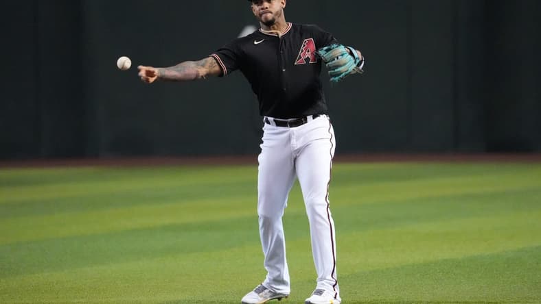 Sep 24, 2022; Phoenix, Arizona, USA; Arizona Diamondbacks second baseman Ketel Marte (4) throws to first base during the first inning against the San Francisco Giants at Chase Field. Mandatory Credit: Joe Camporeale-USA TODAY Sports