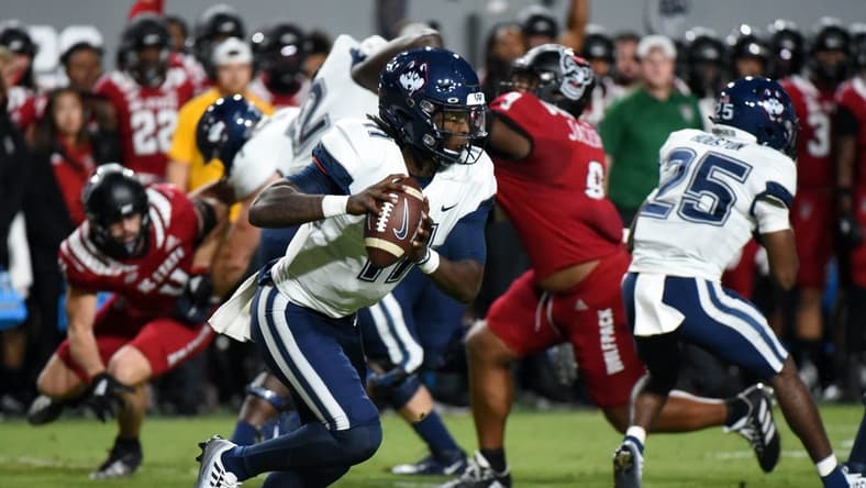 Sep 24, 2022; Raleigh, North Carolina, USA; Connecticut Huskies quarterback Zion Turner (11) looks to pass during the first half against the North Carolina State Wolfpack at Carter-Finley Stadium. Mandatory Credit: Rob Kinnan-USA TODAY Sports