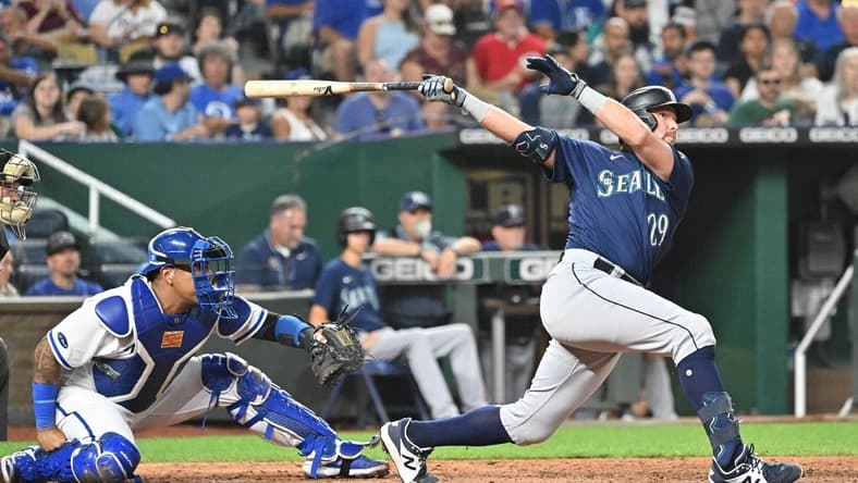 Sep 24, 2022; Kansas City, Missouri, USA;  Seattle Mariners pinch hitter Cal Raleigh (29) hits a two-run home run during the sixth inning against the Kansas City Royals at Kauffman Stadium. Mandatory Credit: Peter Aiken-USA TODAY Sports