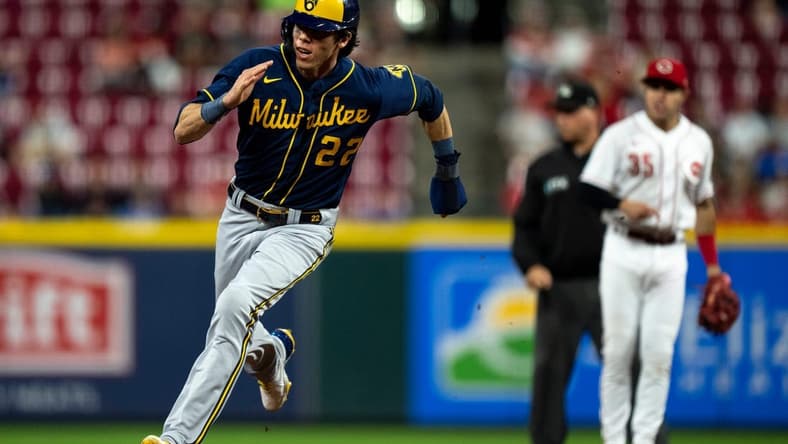 Milwaukee Brewers left fielder Christian Yelich (22) heads towards third before scoring from first on an RBI double hit by Milwaukee Brewers shortstop Willy Adames (27) in the seventh inning of the MLB game between the Cincinnati Reds and the Milwaukee Brewers at Great American Ball Park in Cincinnati on Saturday, Sept. 24, 2022.

Milwaukee Brewers At Cincinnati Reds 158