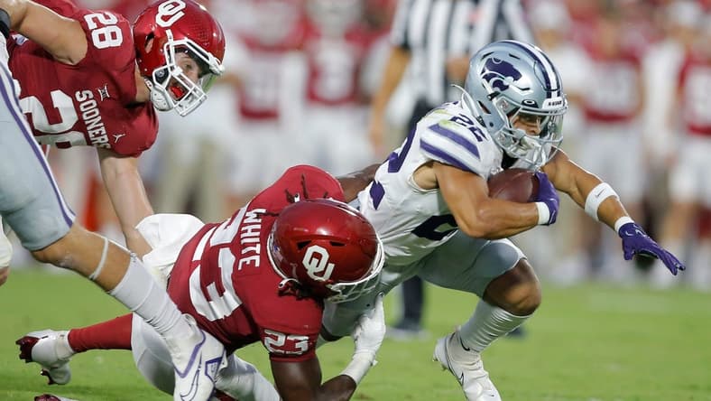 Oklahoma's DaShaun White (23) brings down Deuce Vaughn (22) during a college football game between the University of Oklahoma Sooners (OU) and the Kansas State Wildcats at Gaylord Family - Oklahoma Memorial Stadium in Norman, Okla., Saturday, Sept. 24, 2022.
Ou Vs Kansas State