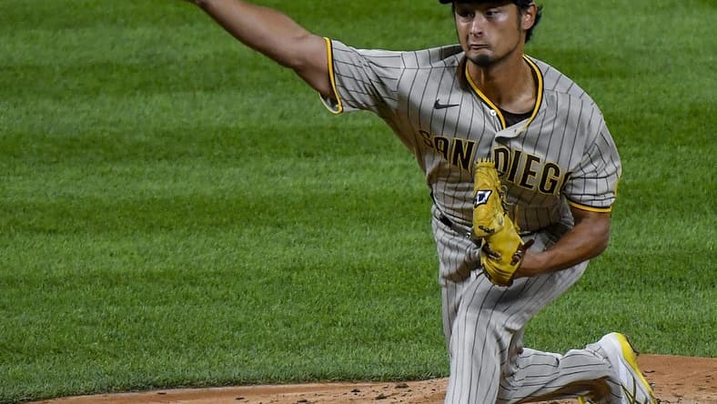 Sep 24, 2022; Denver, Colorado, USA; San Diego Padres starting pitcher Yu Darvish (11) delivers a pitch during the third inning against the Colorado Rockies at Coors Field. Mandatory Credit: John Leyba-USA TODAY Sports