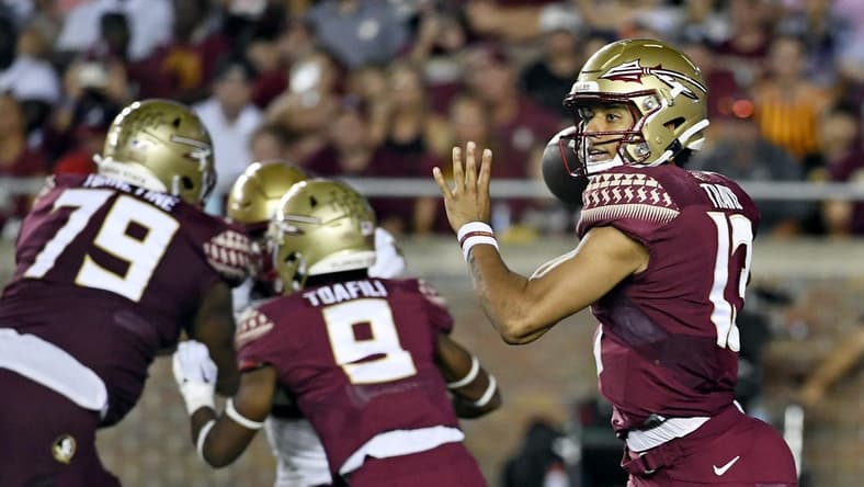 Sep 24, 2022; Tallahassee, Florida, USA; Florida State Seminoles quarterback Jordan Travis (13) drops back to throw the ball against the Boston College Eagles during the second half at Doak S. Campbell Stadium. Mandatory Credit: Melina Myers-USA TODAY Sports