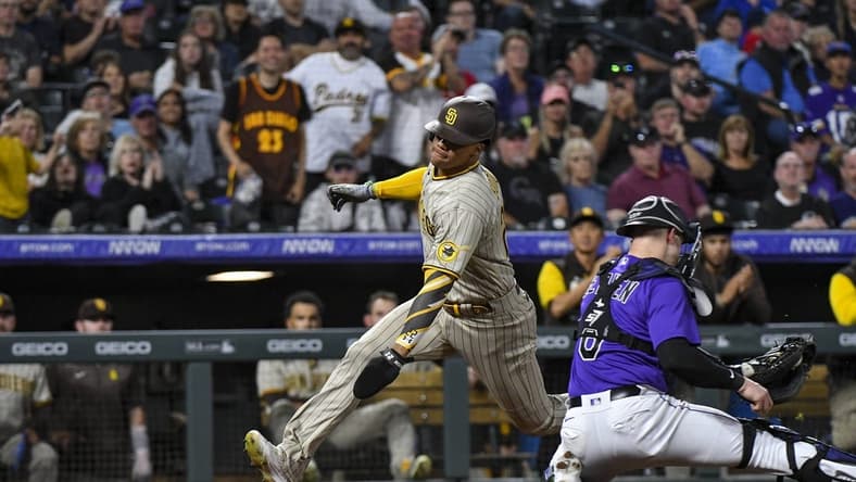 Sep 24, 2022; Denver, Colorado, USA; San Diego Padres left fielder Jurickson Profar (10) gets past Colorado Rockies catcher Brian Serven (6) for a score during the seventh inning at Coors Field. Mandatory Credit: John Leyba-USA TODAY Sports