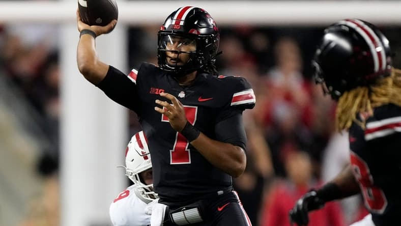 Sep 24, 2022; Columbus, Ohio, USA; Ohio State Buckeyes quarterback C.J. Stroud (7) throws during the second half of the NCAA Division I football game against the Wisconsin Badgers at Ohio Stadium. Ohio State won 52-21. Mandatory Credit: Adam Cairns-The Columbus Dispatch

Ncaa Football Wisconsin Badgers At Ohio State Buckeyes