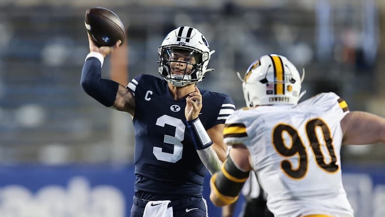 Sep 24, 2022; Provo, Utah, USA; Brigham Young Cougars quarterback Jaren Hall (3) passes the ball against Wyoming Cowboys nose tackle Gavin Meyer (90) in the second quarter at LaVell Edwards Stadium. Mandatory Credit: Rob Gray-USA TODAY Sports