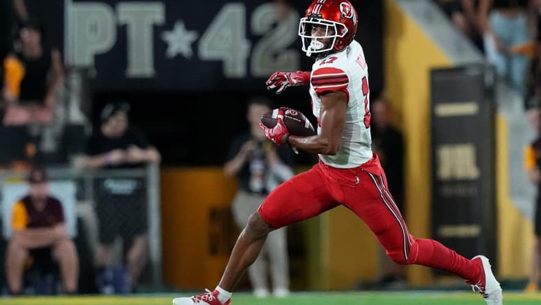 Sep 24, 2022; Tempe, Arizona, USA; Utah Utes wide receiver Devaughn Vele (17) runs after a catch against the Arizona State Sun Devils during the first half at Sun Devil Stadium. Mandatory Credit: Joe Camporeale-USA TODAY Sports