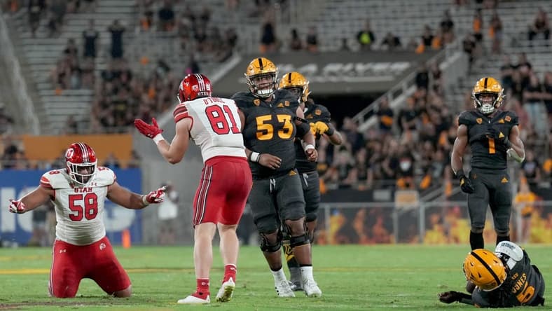 Sep 24, 2022; Tempe, Arizona, USA; Utah Utes defensive tackle Junior Tafuna (58) celebrates after tackling Arizona State Sun Devils quarterback Emory Jones (5) during the second half at Sun Devil Stadium. Mandatory Credit: Joe Camporeale-USA TODAY Sports