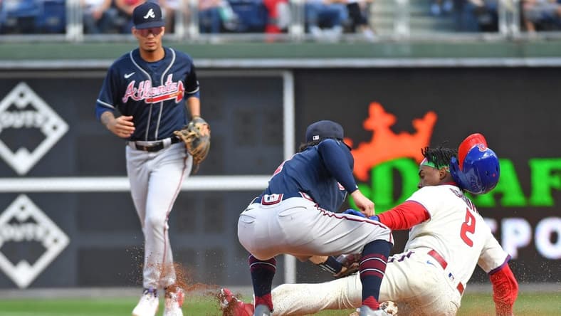 Sep 25, 2022; Philadelphia, Pennsylvania, USA; Atlanta Braves shortstop Dansby Swanson (7) tags out Philadelphia Phillies second baseman Jean Segura (2) trying to steal second base during the first inning at Citizens Bank Park. Mandatory Credit: Eric Hartline-USA TODAY Sports
