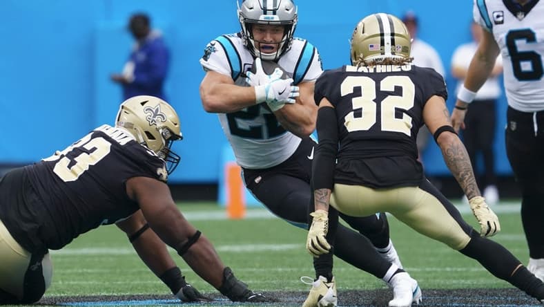 Sep 25, 2022; Charlotte, North Carolina, USA; Carolina Panthers running back Christian McCaffrey (22) runs the ball against the New Orleans Saints during the first quarter at Bank of America Stadium. Mandatory Credit: James Guillory-USA TODAY Sports
