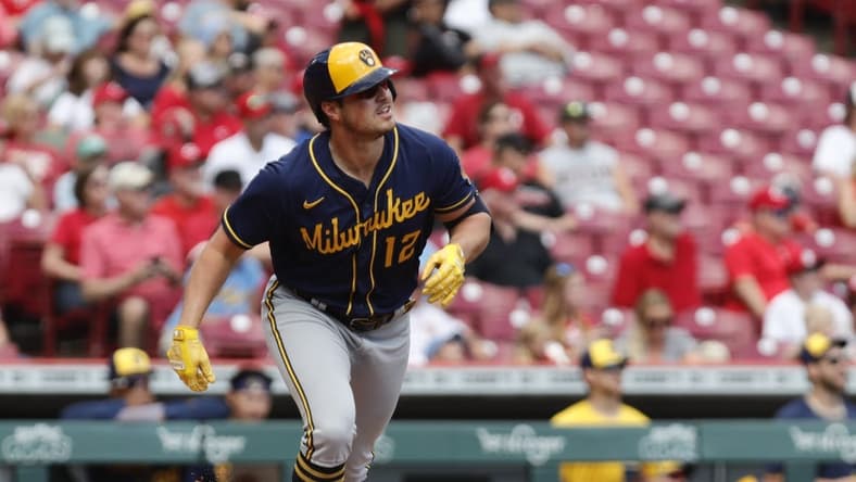 Sep 25, 2022; Cincinnati, Ohio, USA; Milwaukee Brewers right fielder Hunter Renfroe (12) runs after hitting a solo home run against the Cincinnati Reds during the first inning at Great American Ball Park. Mandatory Credit: David Kohl-USA TODAY Sports