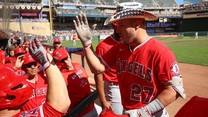 Sep 25, 2022; Minneapolis, Minnesota, USA; Los Angeles Angels center fielder Mike Trout (27) celebrates a solo home run against the Minnesota Twins in the third inning at Target Field. Mandatory Credit: Matt Krohn-USA TODAY Sports