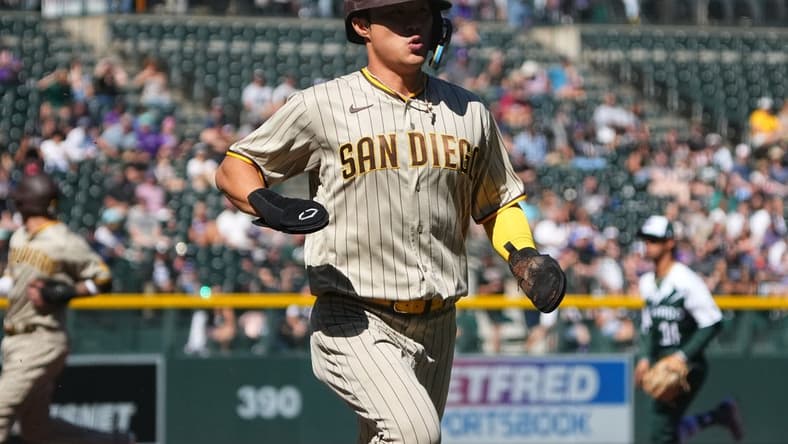 Sep 25, 2022; Denver, Colorado, USA; San Diego Padres shortstop Ha-Seong Kim (7) scores a run in the first inning against the Colorado Rockies at Coors Field. Mandatory Credit: Ron Chenoy-USA TODAY Sports