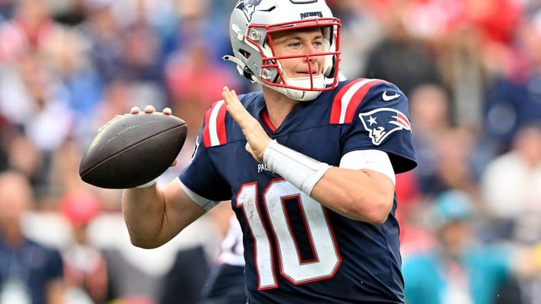 Sep 25, 2022; Foxborough, Massachusetts, USA; New England Patriots quarterback Mac Jones (10) throws the ball against the Baltimore Ravens during the second half at Gillette Stadium. Mandatory Credit: Brian Fluharty-USA TODAY Sports