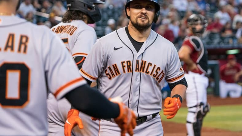 Sep 25, 2022; Phoenix, Arizona, USA; San Francisco Giants infielder J.D. Davis (7) celebrates after hitting a solo home run in the ninth inning against the Arizona Diamondbacks at Chase Field. Mandatory Credit: Allan Henry-USA TODAY Sports