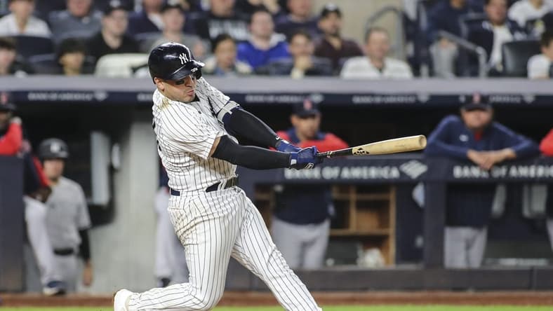 Sep 25, 2022; Bronx, New York, USA; New York Yankees catcher Jose Trevino (39) hits an RBI single in the fourth inning against the Boston Red Sox at Yankee Stadium. Mandatory Credit: Wendell Cruz-USA TODAY Sports
