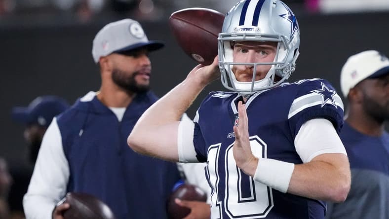 Sep 26, 2022; East Rutherford, New Jersey, USA; Dallas Cowboys quarterback Cooper Rush (10) warms up in front of quarterback Dak Prescott before the game against the New York Giants at MetLife Stadium. Mandatory Credit: Robert Deutsch-USA TODAY Sports