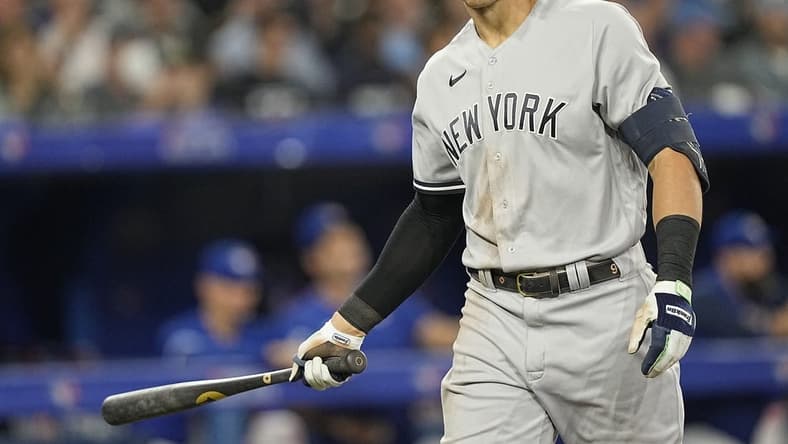 Sep 26, 2022; Toronto, Ontario, CAN; New York Yankees right fielder Aaron Judge (99) spits out his gum after striking out against the Toronto Blue Jays during the sixth inning at Rogers Centre. Mandatory Credit: John E. Sokolowski-USA TODAY Sports