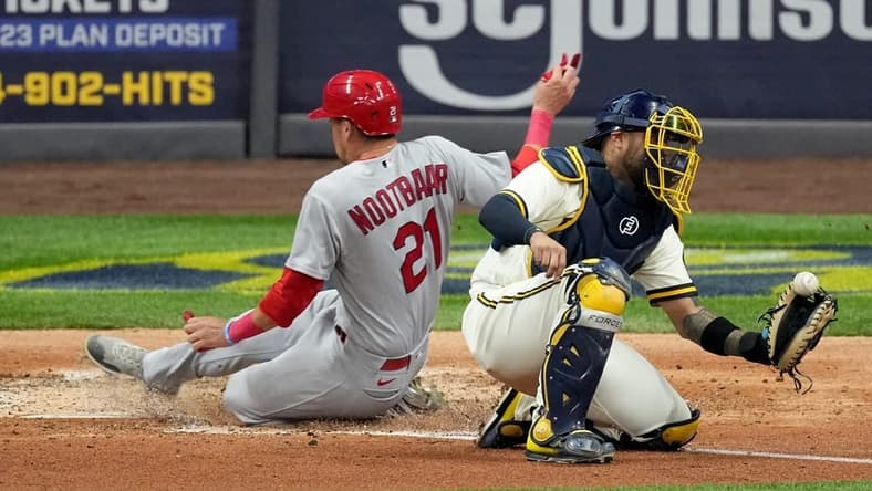 St. Louis Cardinals right fielder Lars Nootbaar (21) beats a show to Milwaukee Brewers center fielder Garrett Mitchell (5) to score on a single by St. Louis Cardinals Paul Goldschmidt during the fifth inning of their game Tuesday, September 27, 2022 at American Family Field in Milwaukee, Wis.

Brewers27 15