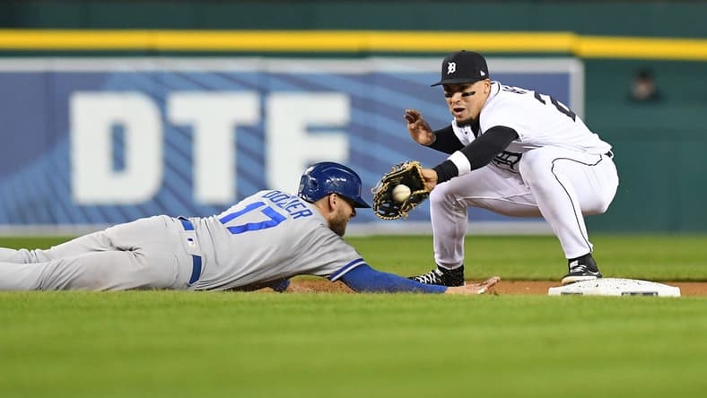 Sep 28, 2022; Detroit, Michigan, USA; Detroit Tigers shortstop Javier Baez (28) (right) takes a throw from relief pitcher Jose Cisnero (not pictured) on a pickoff attempt against Kansas City Royals third baseman Hunter Dozier (17) in the sixth inning at Comerica Park. Mandatory Credit: Lon Horwedel-USA TODAY Sports