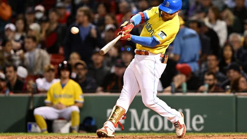 Sep 28, 2022; Boston, Massachusetts, USA; Boston Red Sox left fielder Alex Verdugo (99) hits a solo home run against the Baltimore Orioles during the sixth inning at Fenway Park. Mandatory Credit: Brian Fluharty-USA TODAY Sports