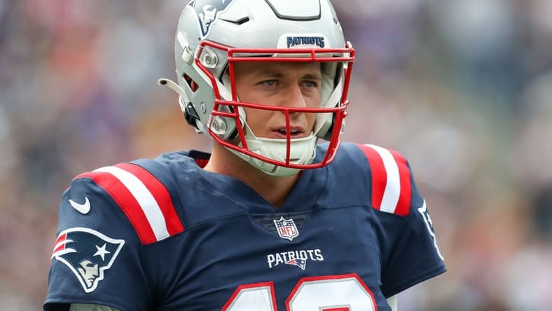 Sep 25, 2022; Foxborough, Massachusetts, USA; New England Patriots quarterback Mac Jones (10) reacts during the first half against the Baltimore Ravens at Gillette Stadium. Mandatory Credit: Paul Rutherford-USA TODAY Sports