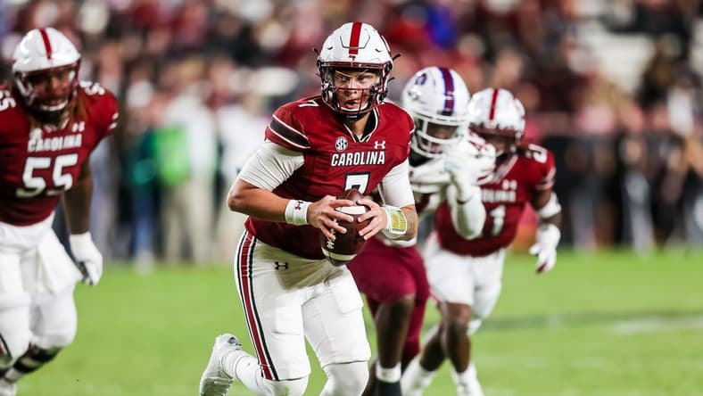 Sep 29, 2022; Columbia, South Carolina, USA; South Carolina Gamecocks quarterback Spencer Rattler (7) runs the ball against the South Carolina State Bulldogs in the second quarter at Williams-Brice Stadium. Mandatory Credit: Jeff Blake-USA TODAY Sports