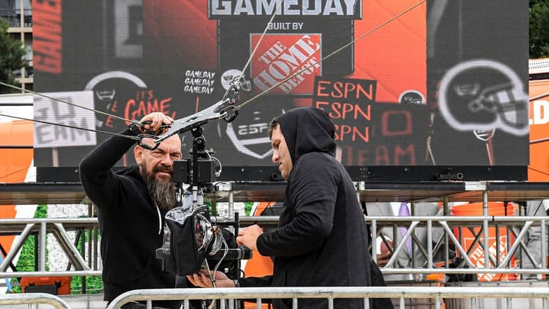 ESPN staff cover a video camera to protect from Hurricane Ian rain, on the ESPN College GameDay Built by The Home Depot set on Bowman Field at Clemson University in Clemson Friday, September 30, 2022. The show's 427th road show, the eighth at Clemson before the game with NC State, airs on television from 9 a.m. to noon Eastern time.
Espn College Gameday On Bowman Field At Clemson