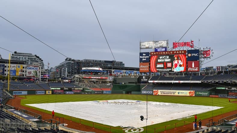 Sep 30, 2022; Washington, District of Columbia, USA; The tarp covers the field before the game between the Washington Nationals and the Philadelphia Phillies at Nationals Park. Mandatory Credit: Brad Mills-USA TODAY Sports