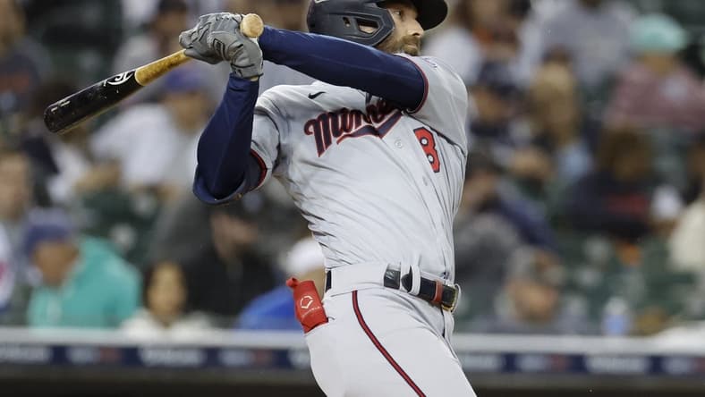 Sep 30, 2022; Detroit, Michigan, USA; Minnesota Twins left fielder Jake Cave (8) hits an RBI single in the fourth inning against the Detroit Tigers at Comerica Park. Mandatory Credit: Rick Osentoski-USA TODAY Sports