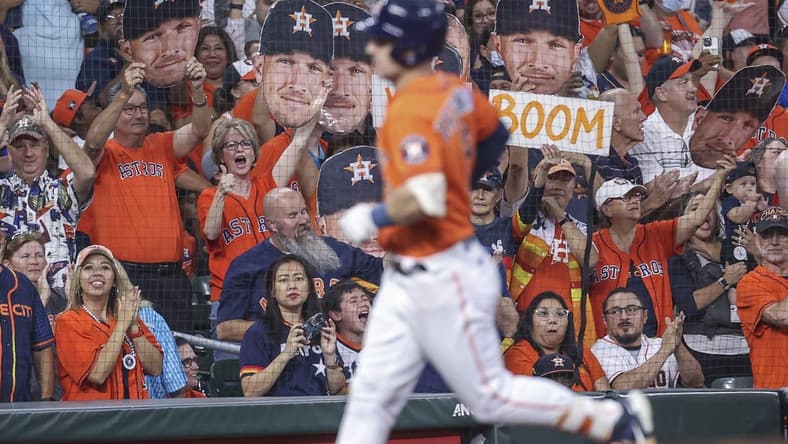Sep 30, 2022; Houston, Texas, USA; Fans cheer and Houston Astros third baseman Alex Bregman (2) rounds the bases after hitting a home run during the first inning against the Tampa Bay Rays at Minute Maid Park. Mandatory Credit: Troy Taormina-USA TODAY Sports