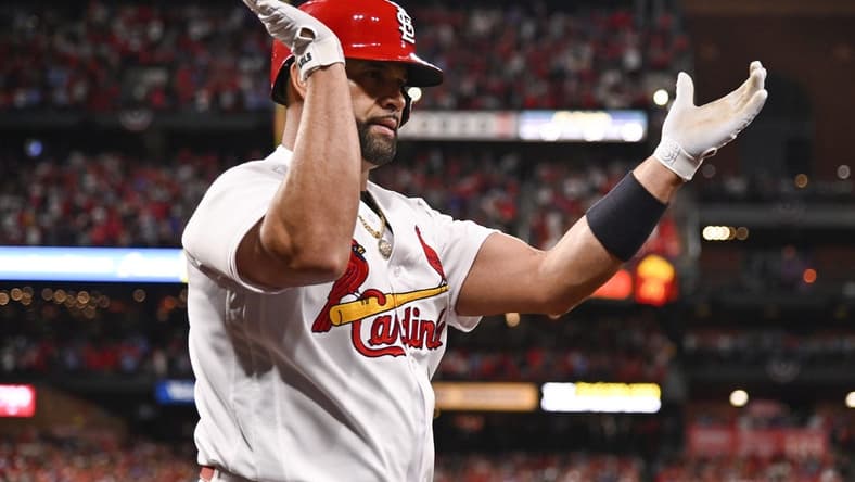 Sep 30, 2022; St. Louis, Missouri, USA; St. Louis Cardinals designated hitter Albert Pujols (5) reacts after hitting a solo home run for his 701st career home run during the fourth inning against the Pittsburgh Pirates at Busch Stadium. Mandatory Credit: Jeff Curry-USA TODAY Sports