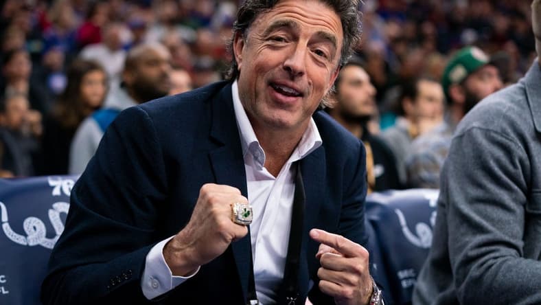 Jan 9, 2020; Philadelphia, Pennsylvania, USA; Boston Celtics owner Wyc Grousbeck points to his championship ring from the sidelines during the first quarter of the game against the Philadelphia 76ers at Wells Fargo Center. Mandatory Credit: Bill Streicher-USA TODAY Sports