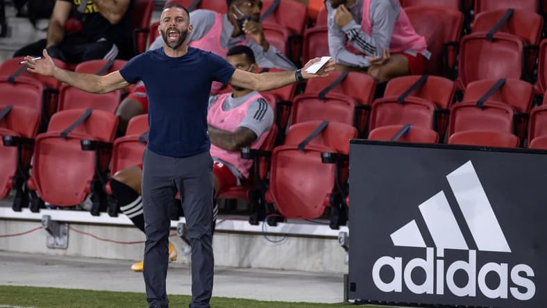 Sep 27, 2020; Washington, D.C., USA; D.C. United head coach Ben Olsen reacts to a play during the first half of the game against the New England Revolution at Audi Field. Mandatory Credit: Scott Taetsch-USA TODAY Sports