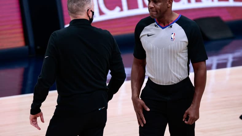 Dec 23, 2020; Denver, Colorado, USA; Denver Nuggets head coach Michael Malone (L) argues a call with referee Tony Brown (R) in the first quarter against the Sacramento Kings at Ball Arena. Mandatory Credit: Isaiah J. Downing-USA TODAY Sports