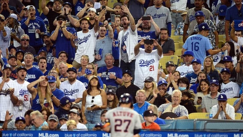 Spectators react toward Houston Astros second baseman Jose Altuve (27) after he flies out against the Los Angeles Dodgers during the third inning at Dodger Stadium. Mandatory Credit: Gary A. Vasquez-USA TODAY Sports