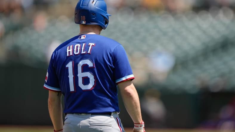 Aug 8, 2021; Oakland, California, USA; Texas Rangers second baseman Brock Holt (16) during the fifth inning against the Oakland Athletics at RingCentral Coliseum. Mandatory Credit: Stan Szeto-USA TODAY Sports