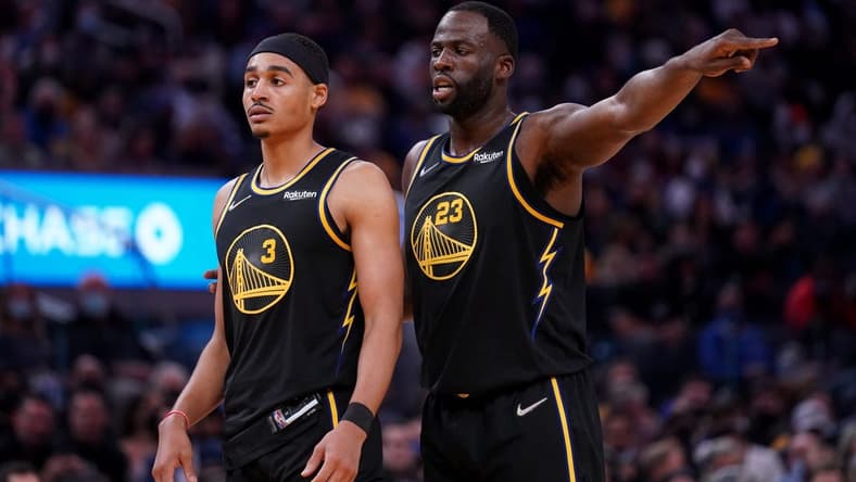 Nov 24, 2021; San Francisco, California, USA; Golden State Warriors forward Draymond Green (23) stands next to guard Jordan Poole (3) during action against the Philadelphia 76ers in the third quarter at the Chase Center. Mandatory Credit: Cary Edmondson-USA TODAY Sports