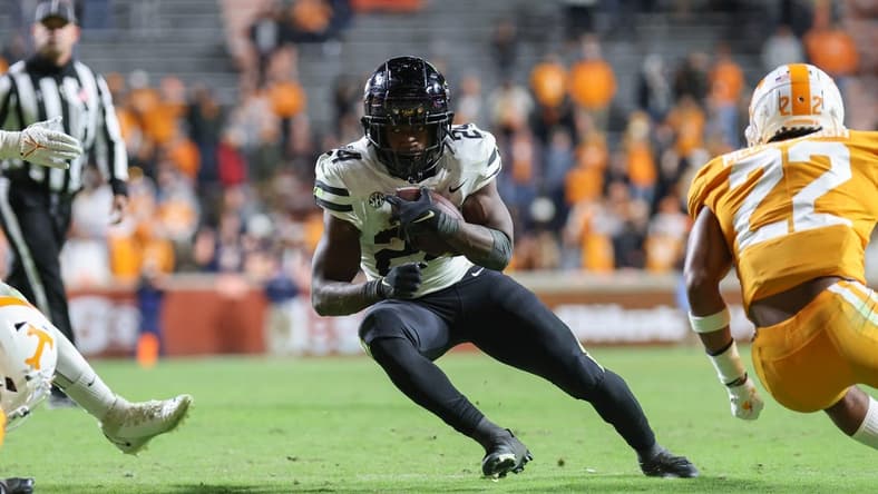 Nov 27, 2021; Knoxville, Tennessee, USA; Vanderbilt Commodores running back Rocko Griffin (24) runs the ball against the Tennessee Volunteers during the second half at Neyland Stadium. Mandatory Credit: Randy Sartin-USA TODAY Sports