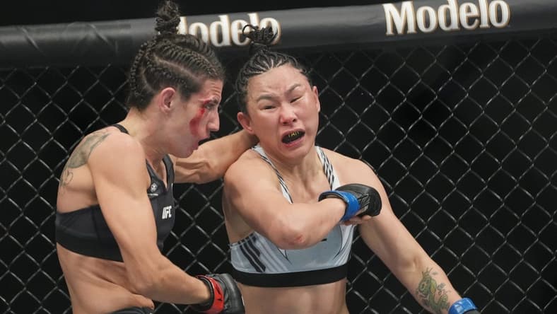 Mar 5, 2022; Las Vegas, Nevada, UNITED STATES; Marina Rodriguez (red gloves) fights Yan Xiaonan (blue gloves) during UFC 272 at T-Mobile Arena. Mandatory Credit: Stephen R. Sylvanie-USA TODAY Sports